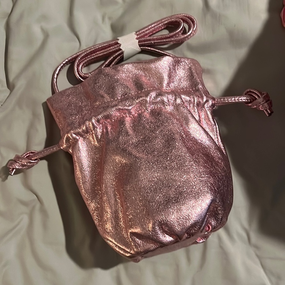 J Crew pink metallic drawstring purse with strap. BNWT. Amazing quality